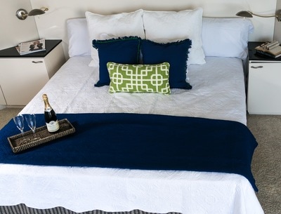 Navy Blue Bedding in this Penthouse Master Bedroom Staging, Aventura Florida
